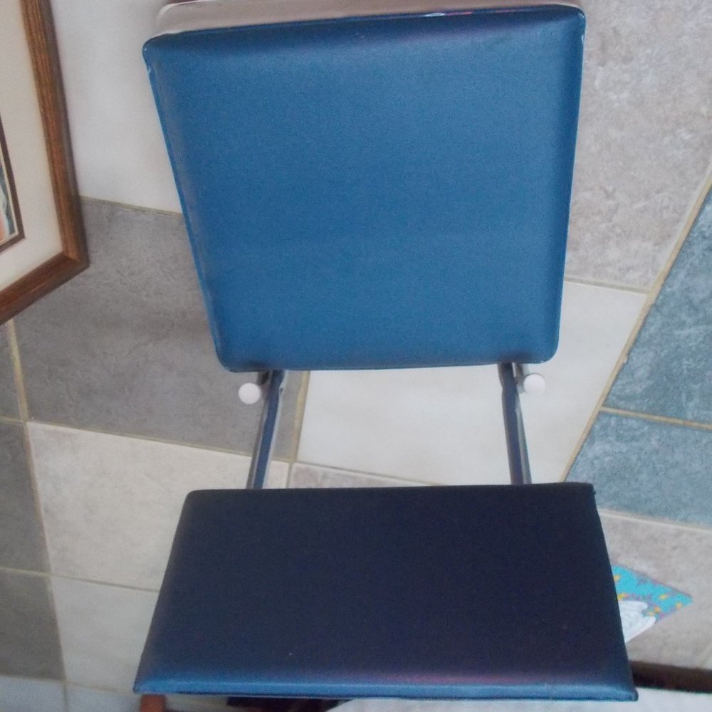 Folding stadium seat.  Go in comfort!  Has hook to attach to bleachers